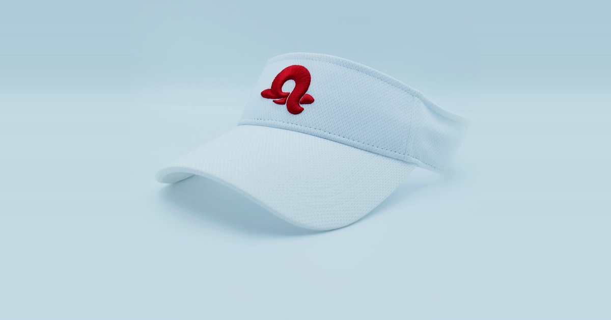 custom flat brim caps sample in white with a red embroidered mark on the front panel
